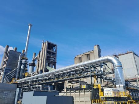 A cement plant fitted with infrastructure for carbon capture.