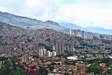 Cityscape of Medellin, with buildings rising up the mountains