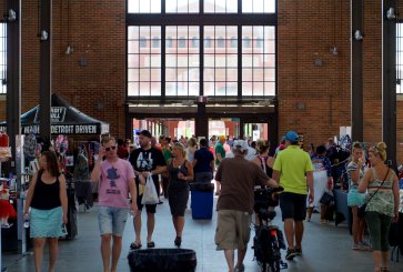 People walk inside Detroit's Eastern Market.