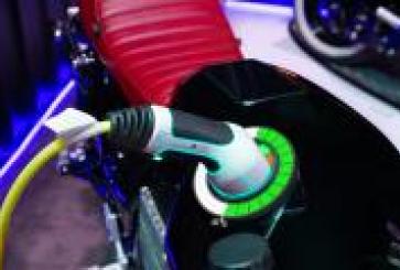Charger plugged into electric vehicle.