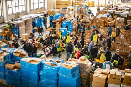 Workers organize food and other supplies for Ukrainian refugees