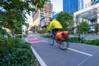 Bike rider on a green urban bike lane