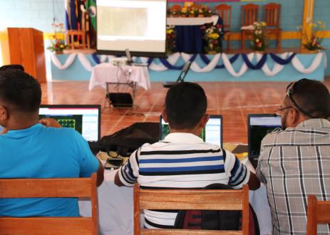 Workshop participants on laptops.
