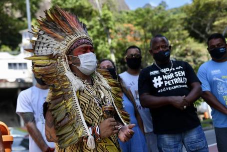 Caption: Indigenous leaders protest against the exploitation of their land in&nbsp;Rio de Janeiro, Brazil.&nbsp;Strong land rights can help indigenous communities protect their communal land and sustainably manage forests.&nbsp;Photo by 350.org/Flickr