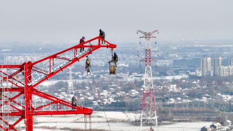 Construction workers erecting a new powerline.