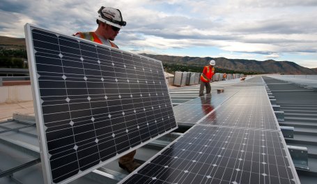 Technician installing solar panels