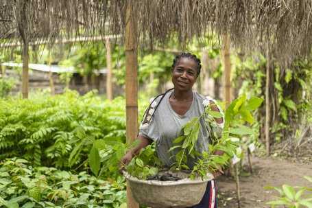 Woman with plants.