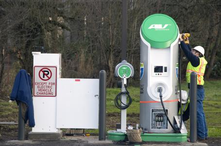 Worker assembling electric charging station