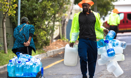 People collect water during the Cape Town water crisis.