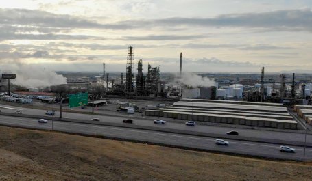 Oil refinery behind a highway in Utah.