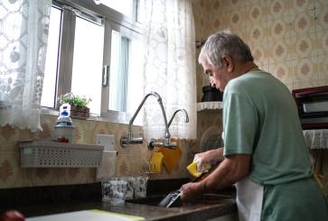 Washing dishes.